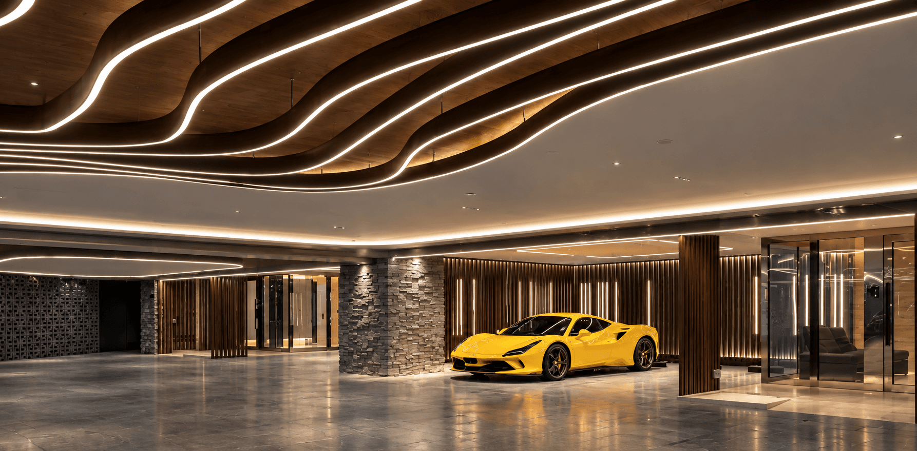 The car gallery at Nassim Quattro, a yellow sports car under curving lines of light